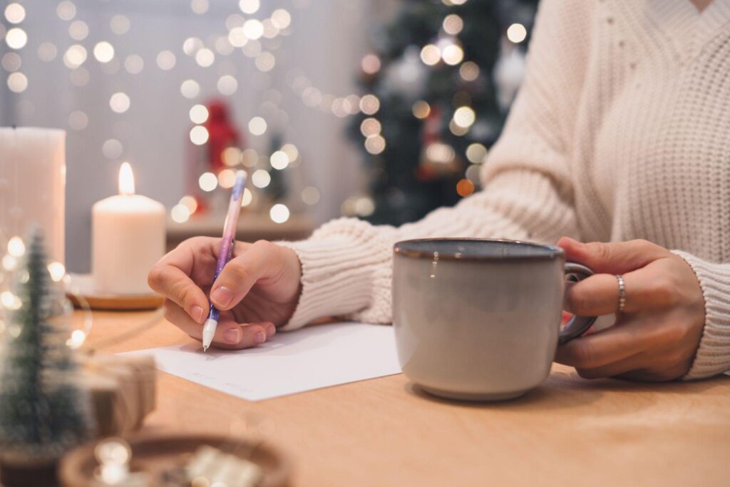 Goals plans make to do and wish list for new year christmas concept writing in notebook. 