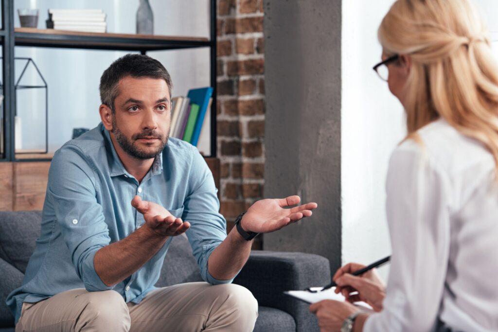 a man with depression and addiction problem attending therapy