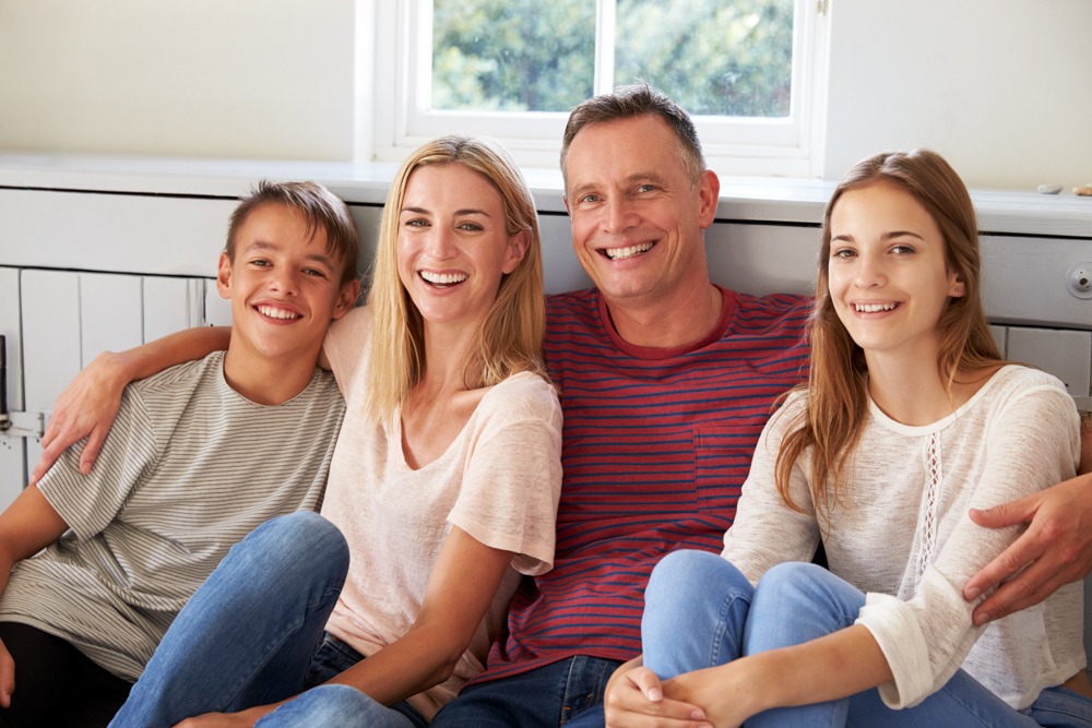 A happy family exploring the impact of family roles in addiction recovery